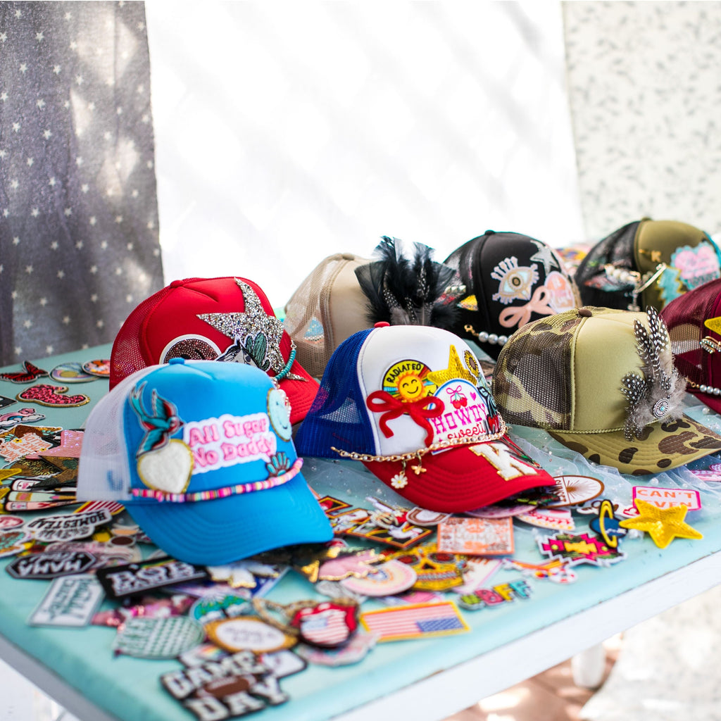 Collection of colorful hats with various designs on a table