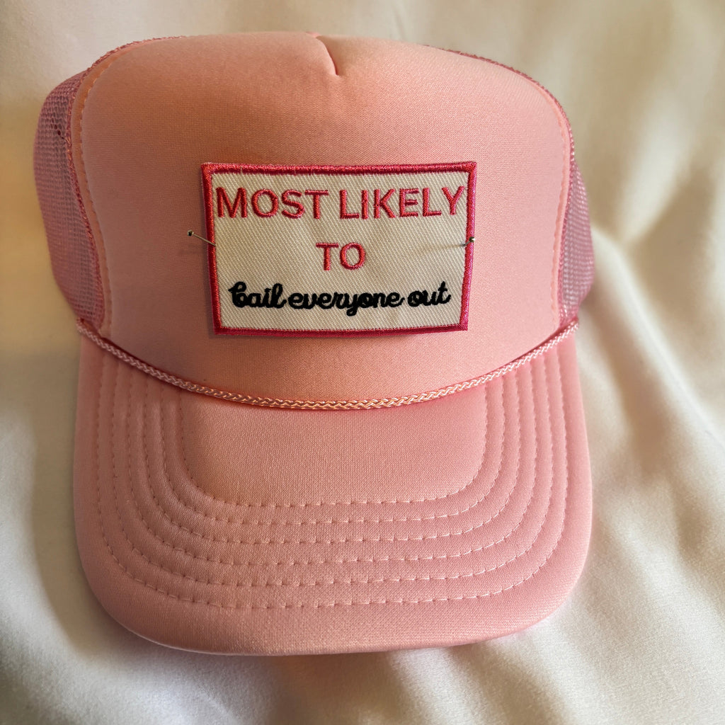 Pink cap with a patch on a beige background