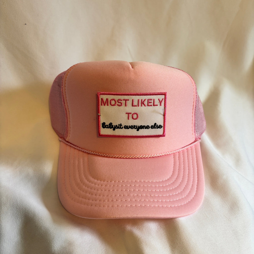 Pink cap with a patch on a light-colored fabric background