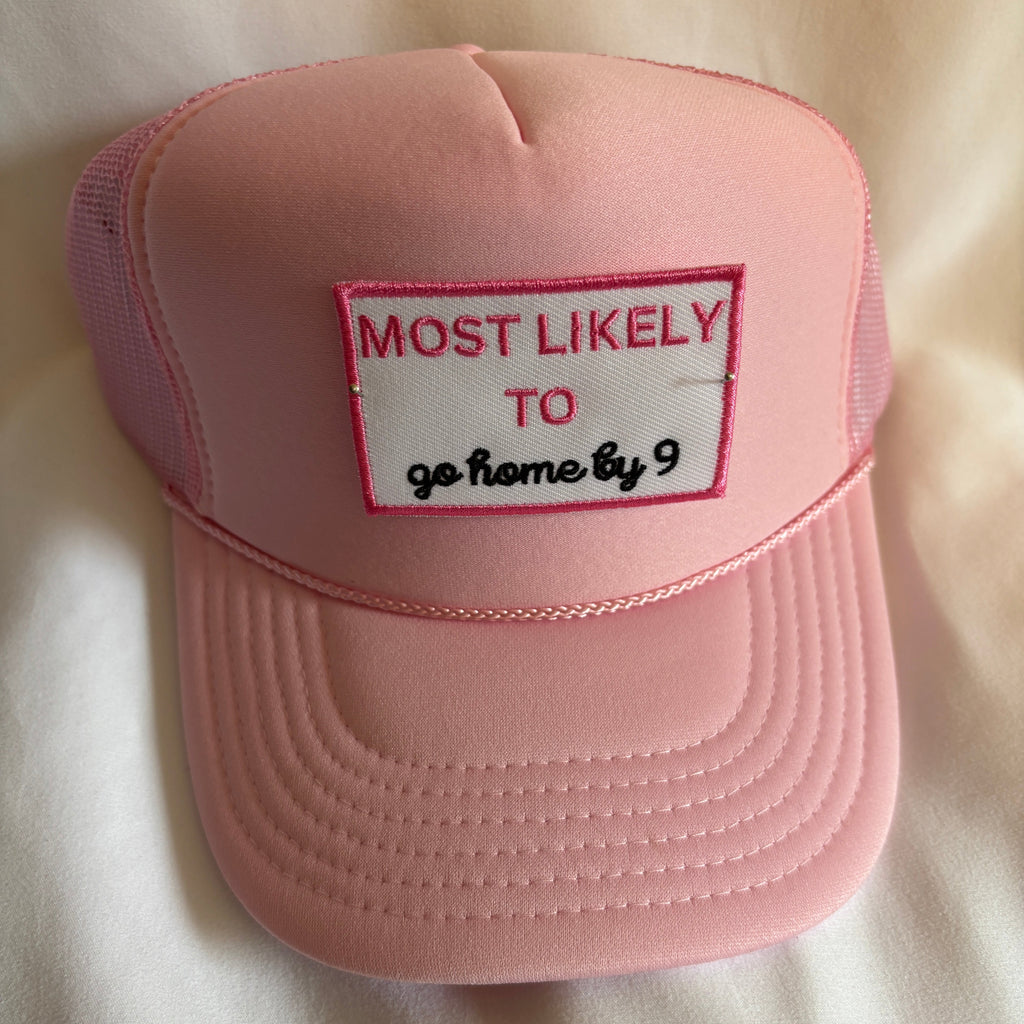 Pink cap with a patch on a light beige background