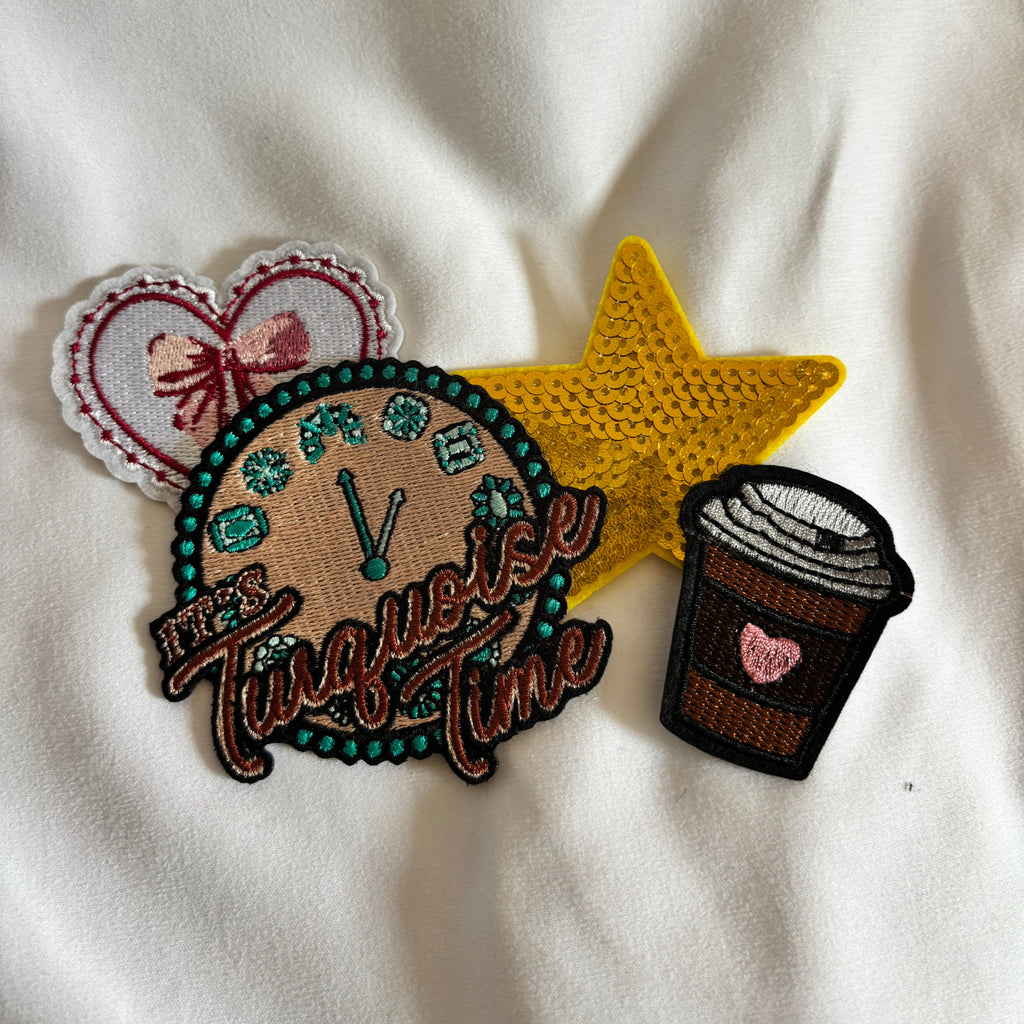 Embroidered patches on a white fabric background